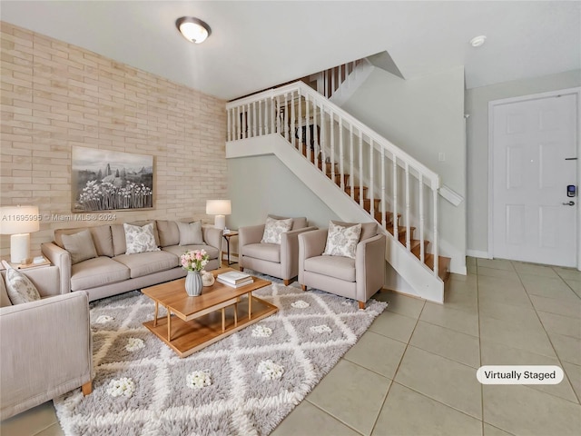 tiled living room with brick wall