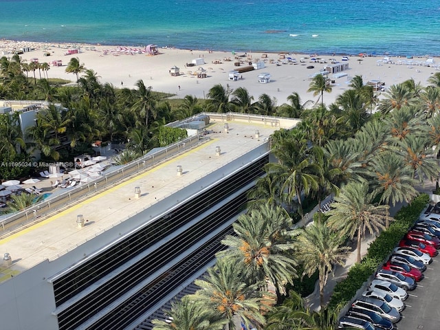 aerial view with a water view and a view of the beach