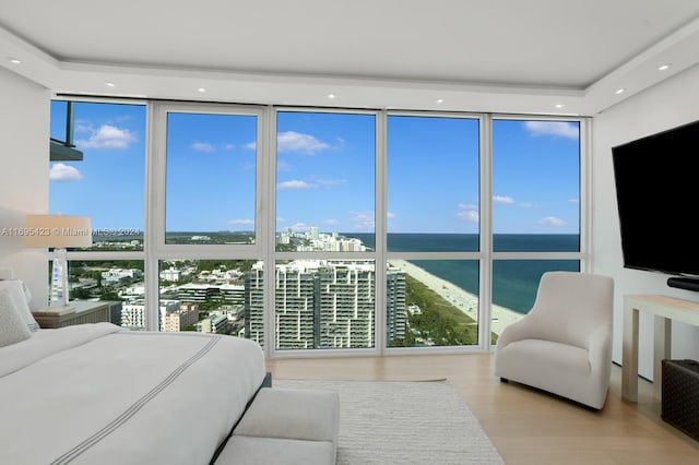 101 20th St Unit 3503/06/09, Miami Beach, FL 33139 - bedroom with floor to ceiling windows and wood finished floors