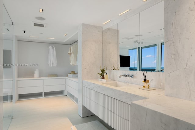 101 20th St Unit 3503/06/09, Miami Beach, FL 33139 - bathroom with vanity and backsplash