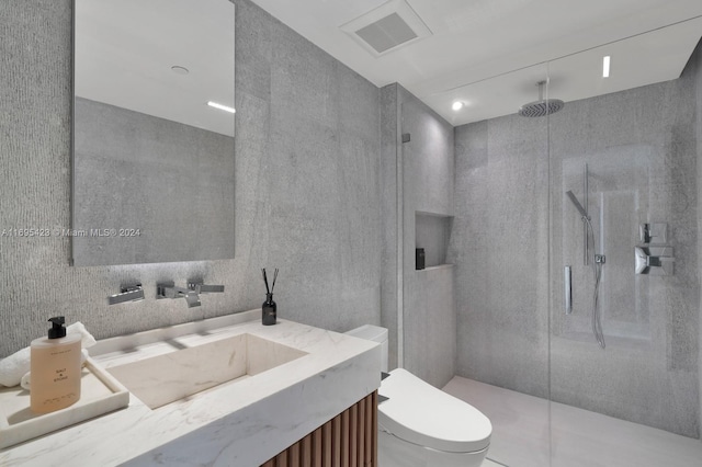 101 20th St Unit 3503/06/09, Miami Beach, FL 33139 - bathroom featuring walk in shower, vanity, and tile walls