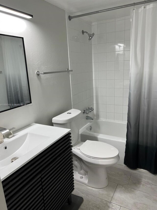 401 Golden Isles Dr Unit 303, Hallandale Beach, FL 33009 - full bathroom featuring shower / bathtub combination with curtain, vanity, and toilet