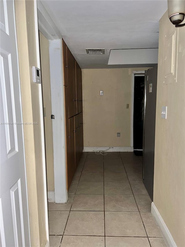 hallway featuring light tile patterned flooring