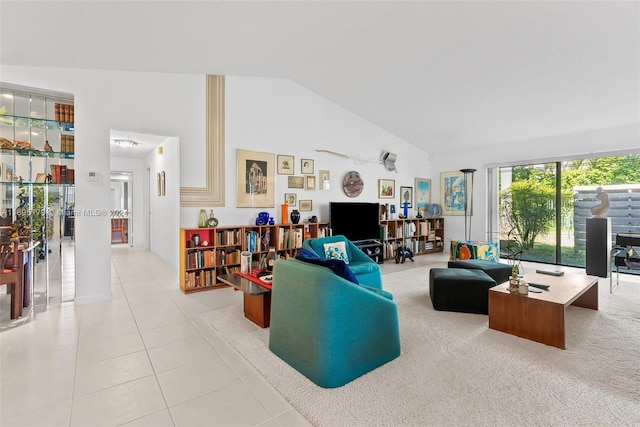 tiled living room with high vaulted ceiling