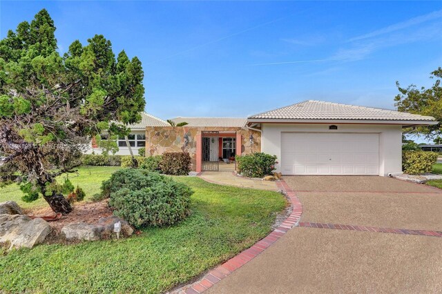 view of front facade with a front lawn and a garage