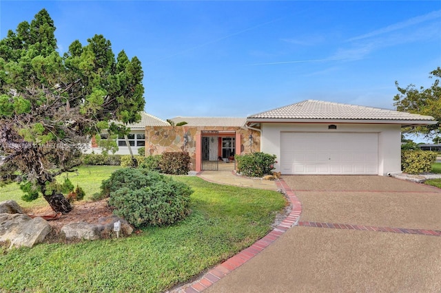 ranch-style house with a garage and a front lawn