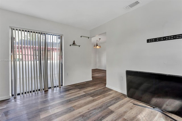 empty room featuring wood-type flooring