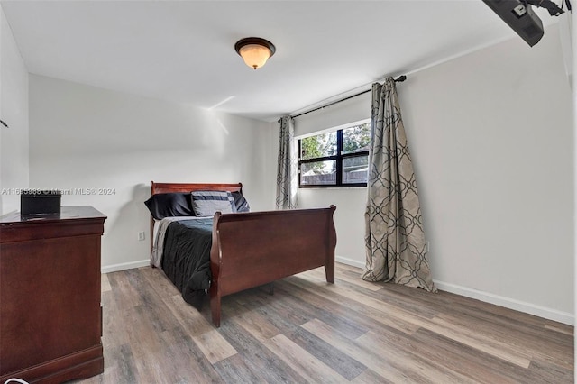 bedroom with wood-type flooring