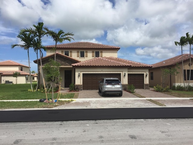 515 SE 35th Ave, Homestead, FL 33033 - mediterranean / spanish home with an attached garage, stucco siding, a tiled roof, and driveway