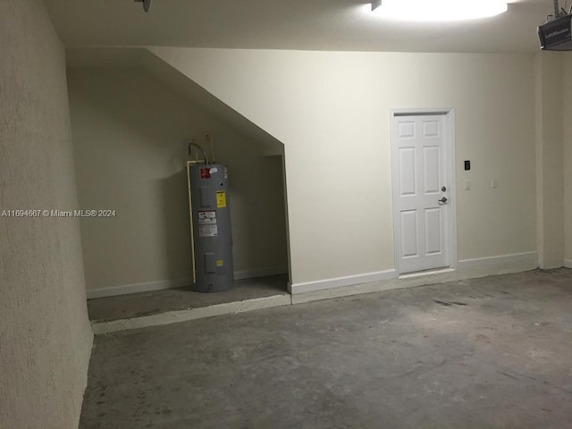 garage featuring a garage door opener and water heater