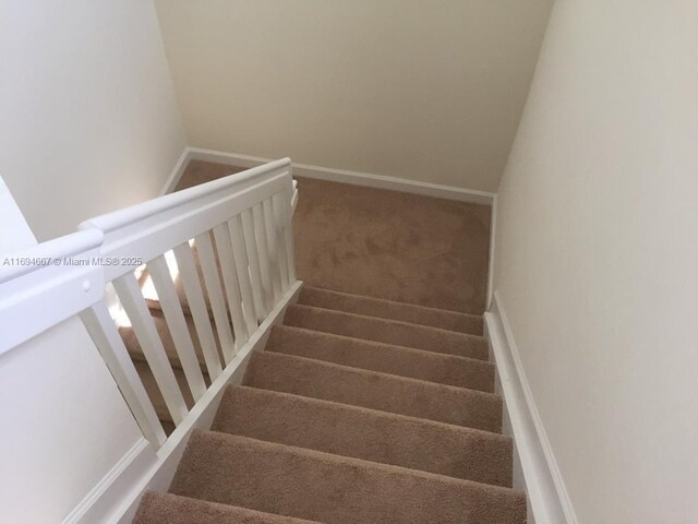515 SE 35th Ave, Homestead, FL 33033 - stairs with carpet flooring and baseboards