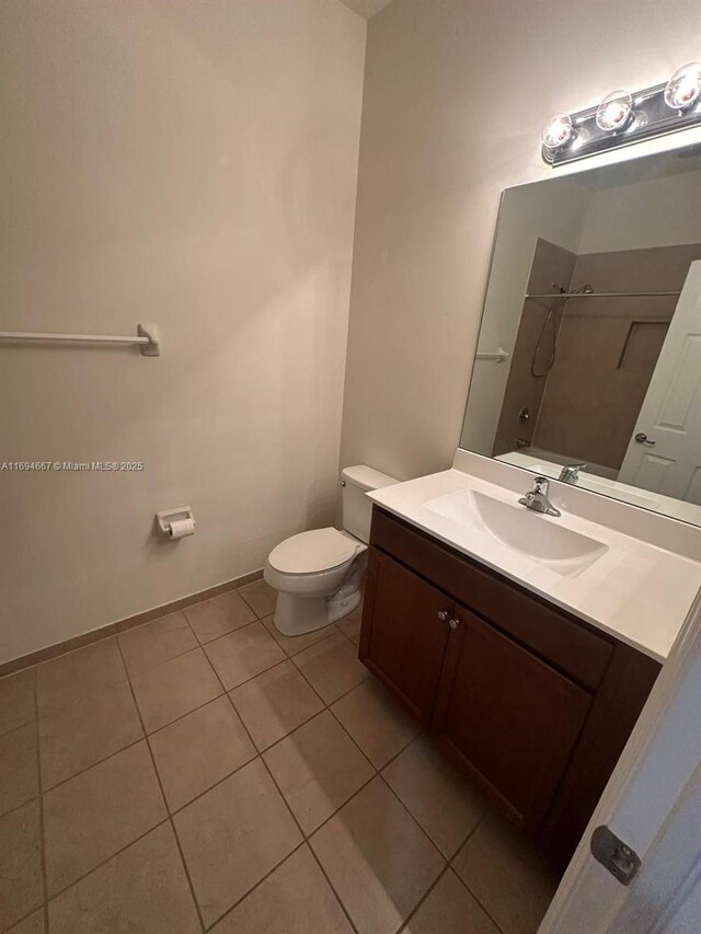 515 SE 35th Ave, Homestead, FL 33033 - full bathroom with toilet, vanity, tile patterned floors, a shower, and baseboards