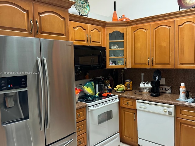 kitchen with decorative backsplash and white appliances