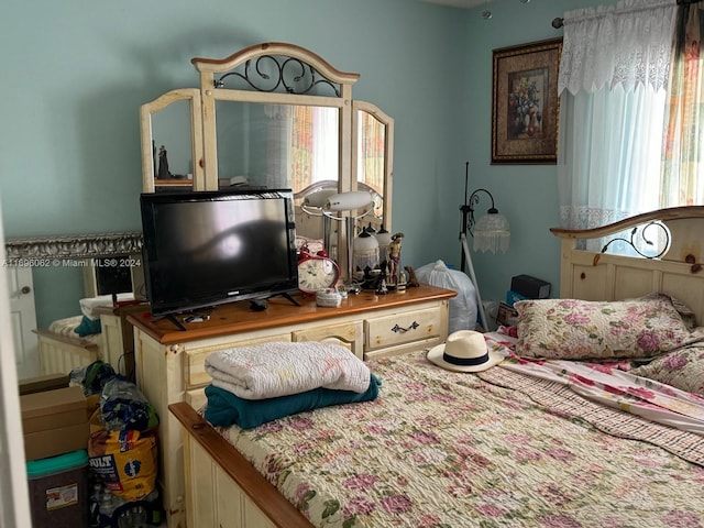 bedroom with multiple windows