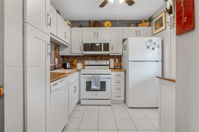 kitchen with backsplash, white cabinetry, light tile patterned flooring, and white appliances