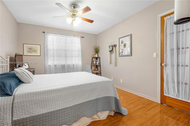 bedroom featuring ceiling fan and wood-type flooring