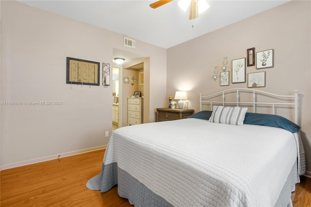 bedroom with hardwood / wood-style floors and ceiling fan