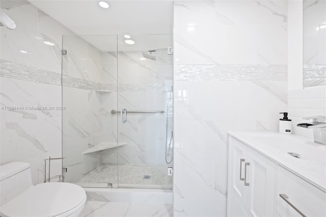 bathroom with an enclosed shower, vanity, toilet, and tile walls