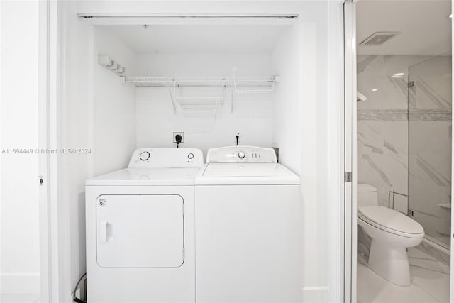 laundry area with washer and dryer