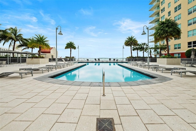 view of swimming pool featuring a patio