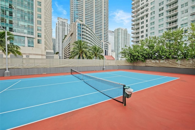 view of tennis court featuring basketball court