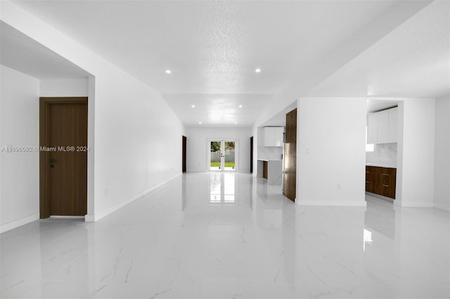 interior space with a textured ceiling