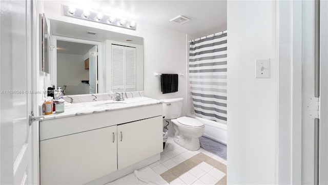 bathroom with a shower with shower curtain, tile patterned floors, vanity, and toilet