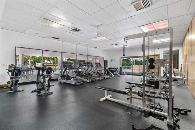 gym featuring a drop ceiling