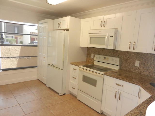 kitchen with white cabinetry, light tile patterned floors, white appliances, and ornamental molding