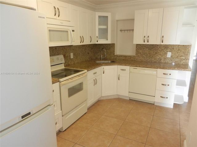 kitchen with white appliances, white cabinets, sink, ornamental molding, and stone countertops