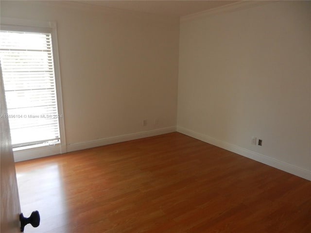 spare room featuring hardwood / wood-style floors