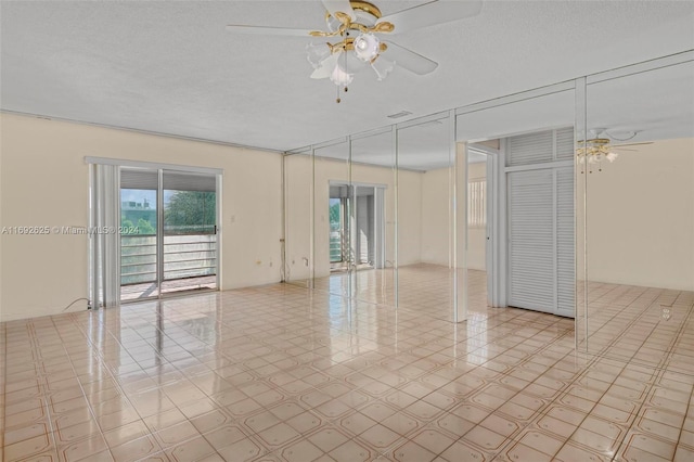 17000 NE 14th Ave Unit 301, North Miami Beach, FL 33162 - spare room with ceiling fan and a textured ceiling