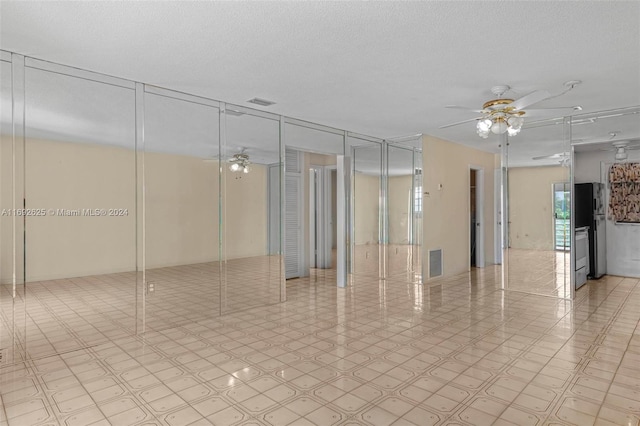 17000 NE 14th Ave Unit 301, North Miami Beach, FL 33162 - unfurnished room featuring a ceiling fan and a textured ceiling
