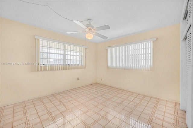 unfurnished room with ceiling fan