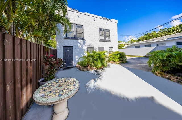 back of property with a patio area