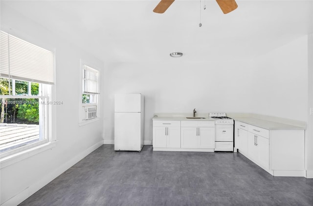 interior space featuring ceiling fan and sink