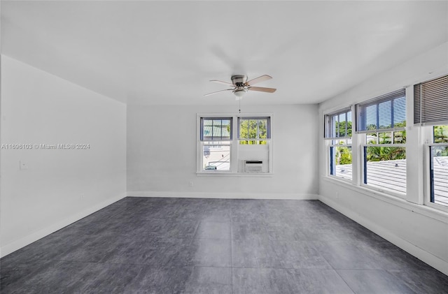 spare room with ceiling fan and cooling unit