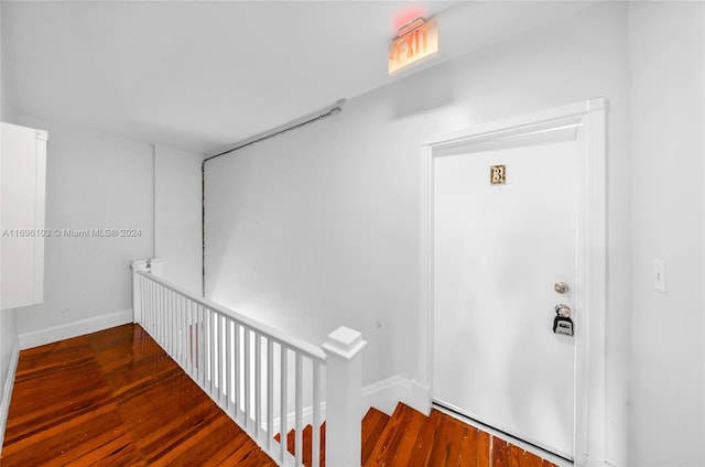 corridor featuring dark hardwood / wood-style floors