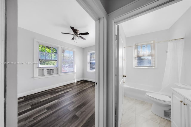 full bathroom with ceiling fan, hardwood / wood-style floors, shower / bath combination, toilet, and vanity