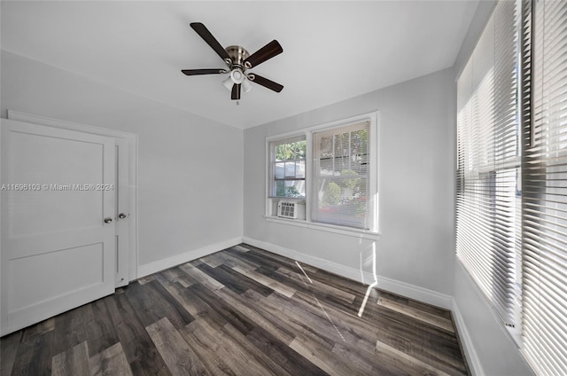 interior space featuring ceiling fan and dark wood-type flooring