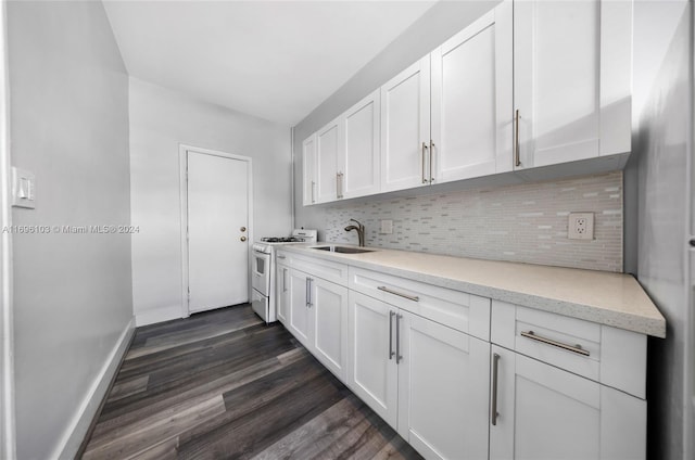 kitchen with light stone counters, dark wood-type flooring, sink, white cabinets, and white gas stove