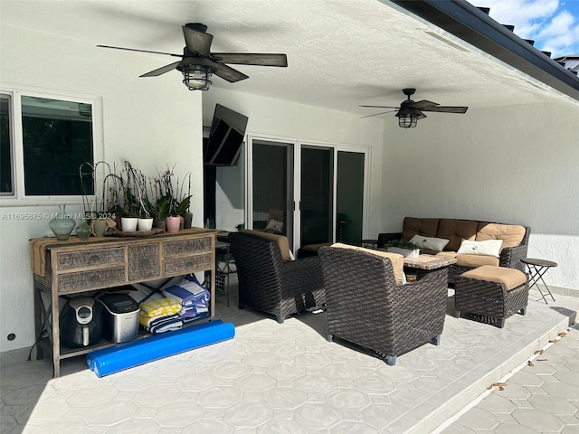 view of patio featuring an outdoor living space and ceiling fan