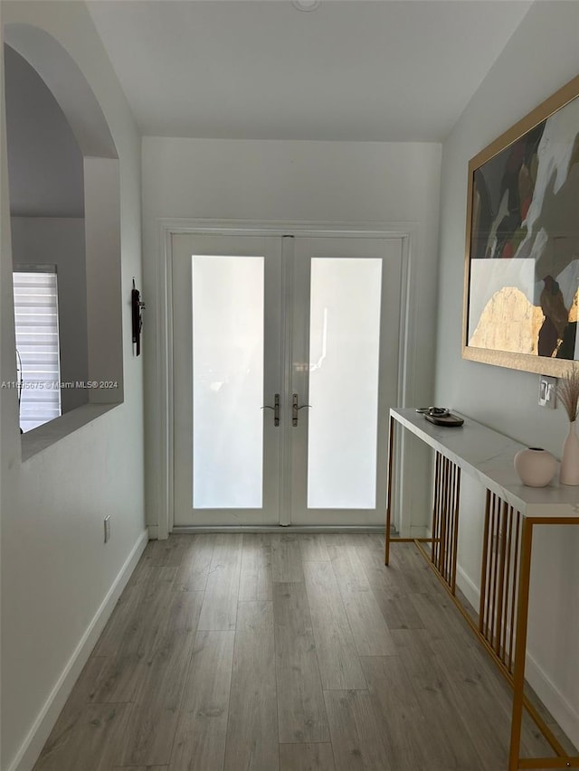 doorway featuring french doors and hardwood / wood-style flooring