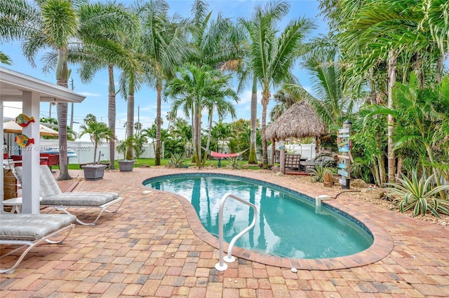 view of swimming pool with a gazebo, a fenced in pool, a fenced backyard, and a patio