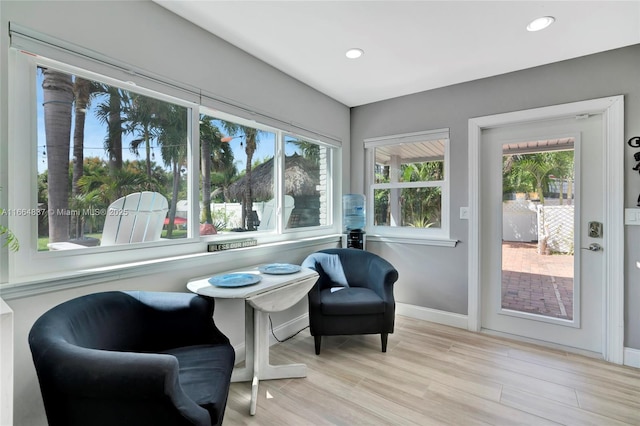 sitting room with recessed lighting, baseboards, and wood finished floors