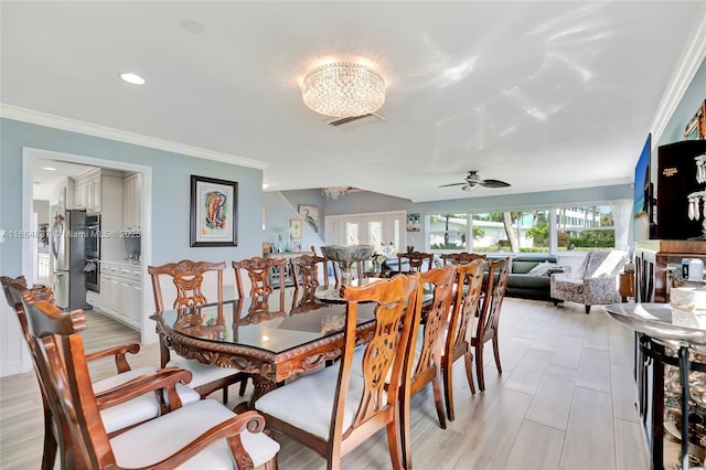 dining space with recessed lighting, visible vents, ceiling fan with notable chandelier, and crown molding