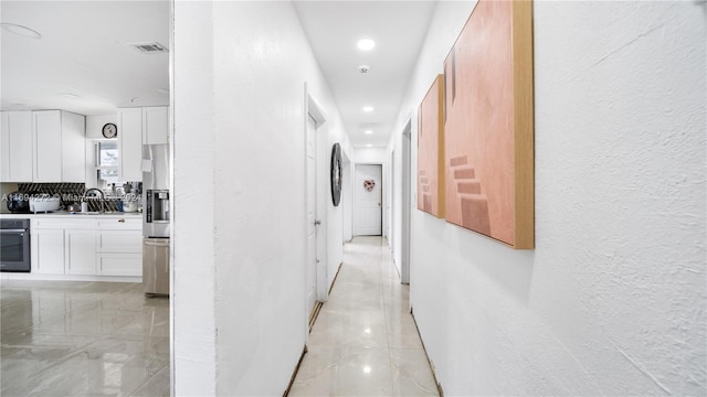 hallway featuring sink