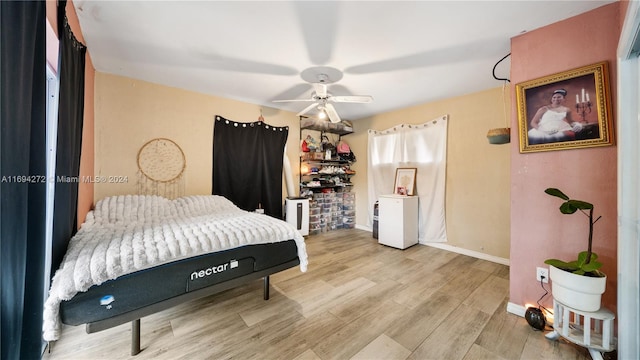 bedroom featuring ceiling fan and light wood-type flooring