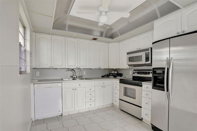 kitchen with white cabinets, ceiling fan, sink, and stainless steel appliances