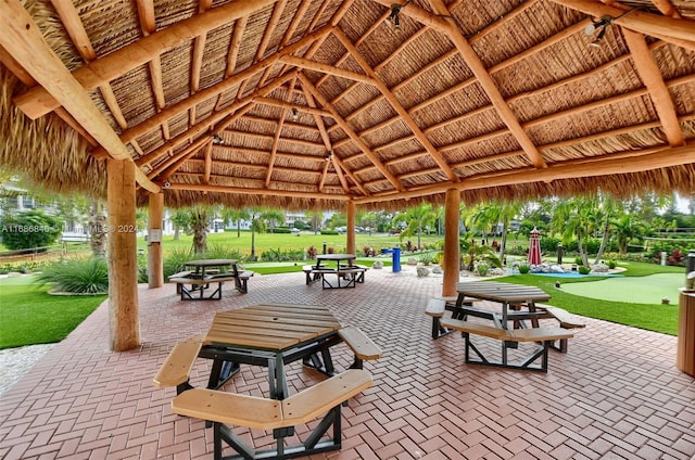 view of community with a gazebo, a patio area, and a yard